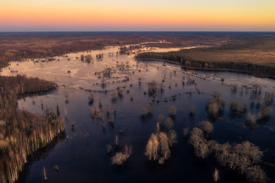 High angle view of lake against sky during sunset