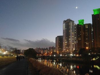 Illuminated buildings in city at night