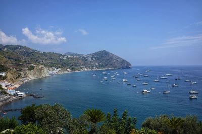 High angle view of boats in sea against sky