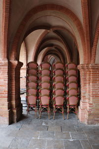 Stack of chairs on floor in building