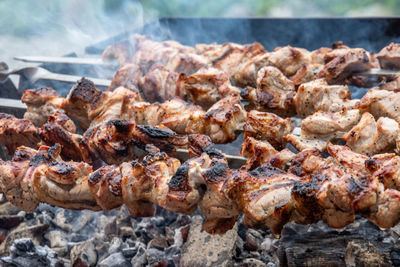 Close-up of meat on barbecue grill