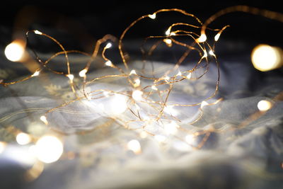 Close-up of illuminated lights at night