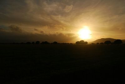 Scenic view of landscape against sky during sunset