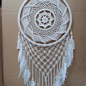 Close-up of dreamcatcher on wall