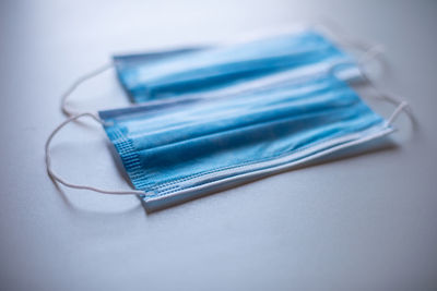 High angle view of colored pencils on white background