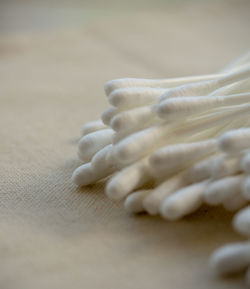 Close-up of woman hand on white surface