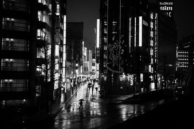 Illuminated modern buildings in city at night