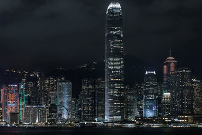 Low angle view of skyscrapers lit up at night