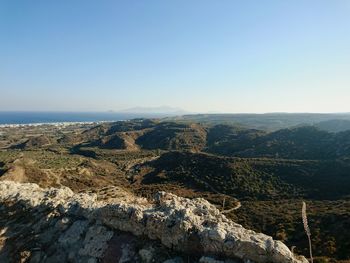 Scenic view of rocky landscape against clear blue sky