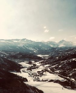 Scenic view of snowcapped mountains against sky