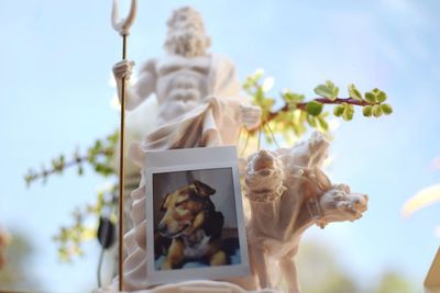 Low angle view of statue against sky