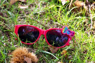 Close-up of sunglasses on grass