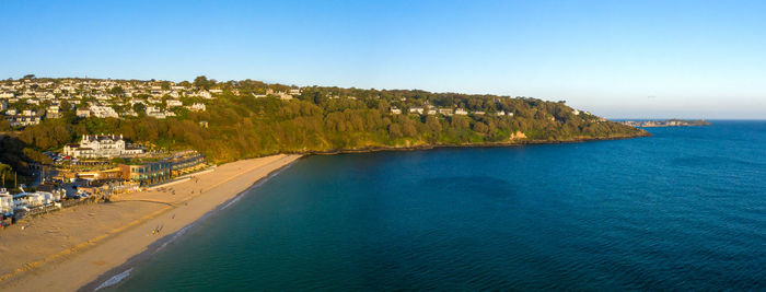 Scenic view of sea against clear blue sky