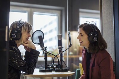 Woman broadcasting from radio station