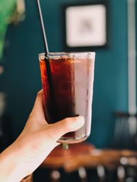 Close-up of hand holding drink