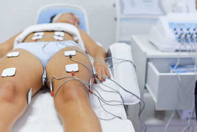 Midsection of woman sitting on floor