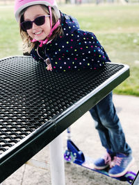 Young woman wearing sunglasses standing outdoors