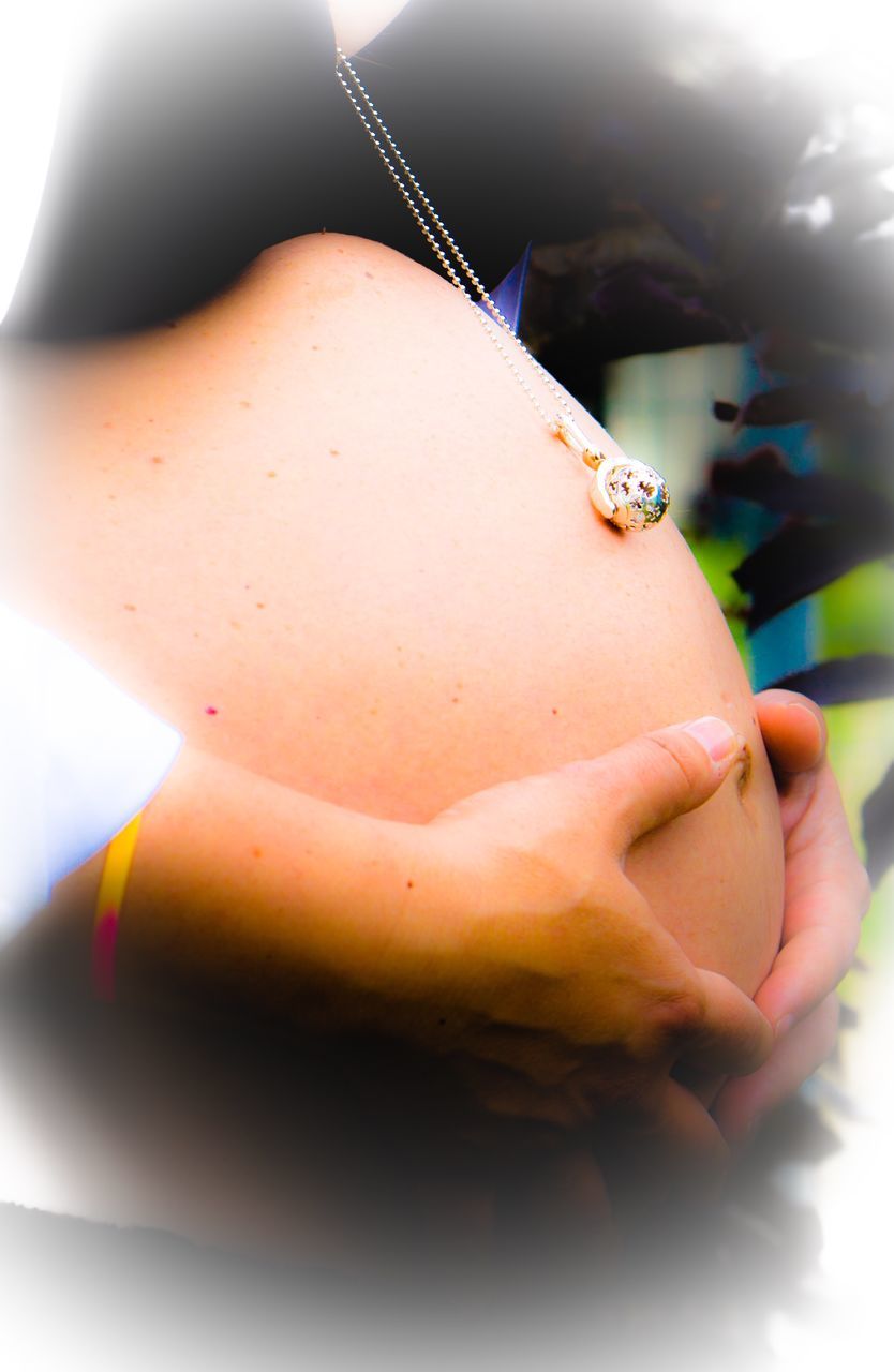 CLOSE-UP OF INSECT ON HUMAN HAND