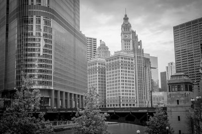 Low angle view of buildings against cloudy sky