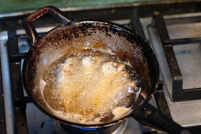 High angle view of meat in cooking pan