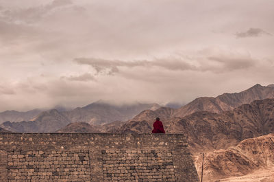 Scenic view of mountain against cloudy sky