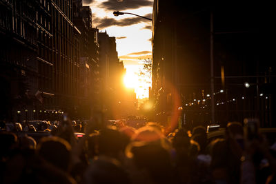 Crowd in city during sunny day