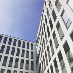 Low angle view of office building against sky