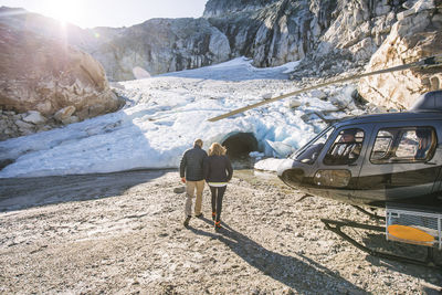 Retired couple take helicopter to see glacial ice cave.