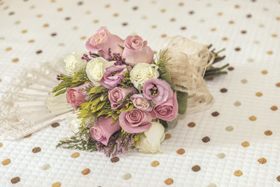 High angle view of pink rose on table