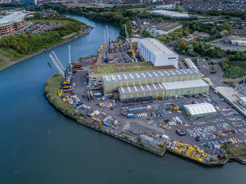 High angle view of harbor by river in city