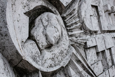 Close-up of cravings on wall at memento park