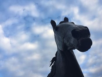 Low angle view of statue against sky