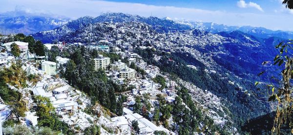 High angle view of snowcapped mountain against sky
