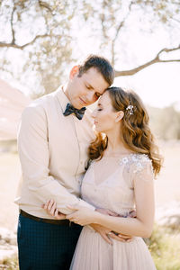 Portrait of bride holding bouquet