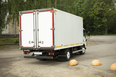 Rear view of man sitting on road