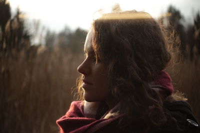 Thoughtful young woman looking away