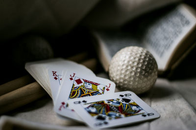 Close-up of playing cards by ball