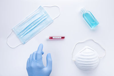 High angle view of cleaning equipment against white background