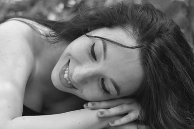 Close-up of young woman with eyes closed