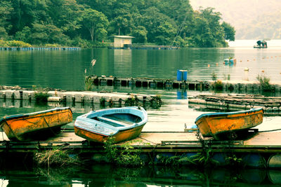 Boats moored at lake