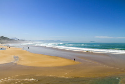 Scenic view of beach against blue sky biarritz france 