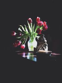 Flower vase against black background