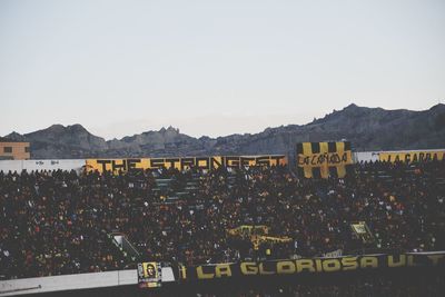 High angle view of people in city against clear sky