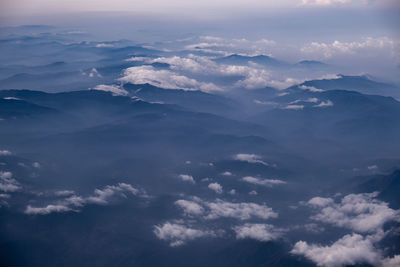 Aerial view of clouds over mountains