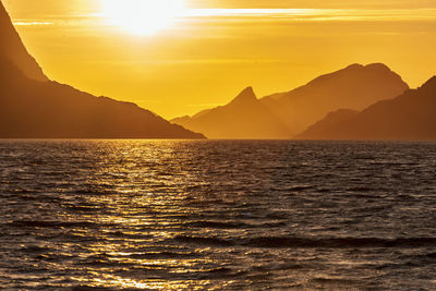 Seascape view at a mountainous archipelago at sunset