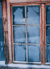 Broken glass window of old building