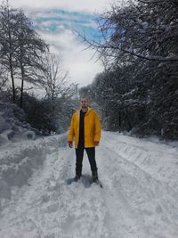 Full length of woman on snow covered field