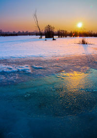 Scenic view of sea against clear sky during sunset