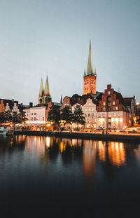 Reflection of city buildings in river