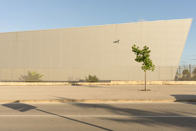 Street by building against clear sky